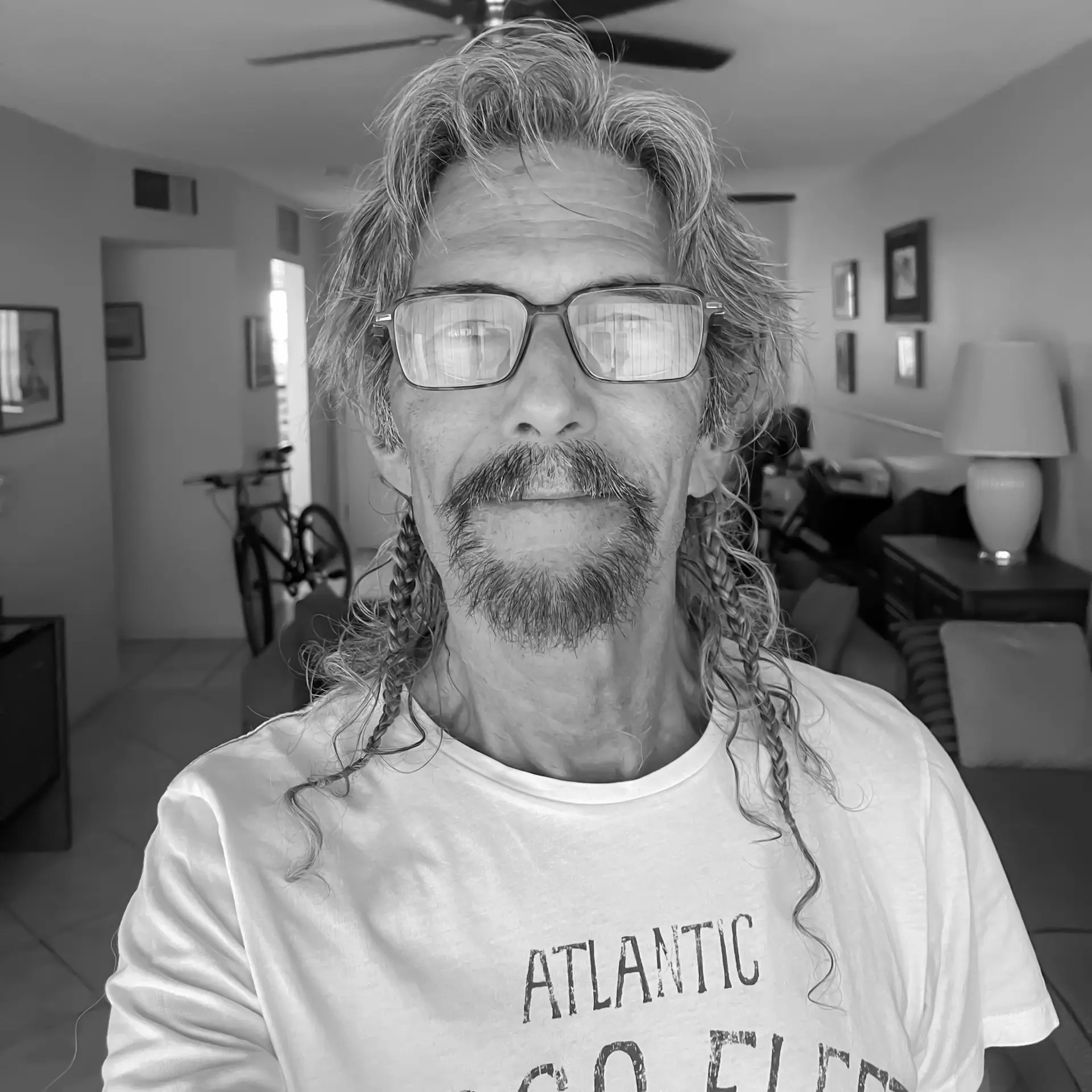 Lorenzo Dawson, Everyday Faith Podcast guest, portrait with braided hair and glasses.