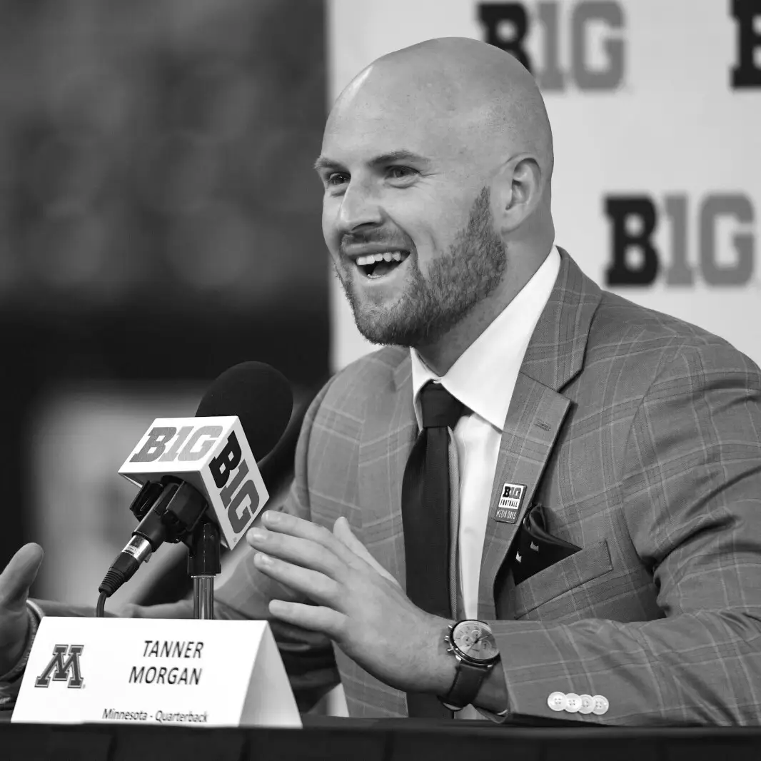Tanner Morgan, podcast guest and former Minnesota quarterback, speaking into microphone.