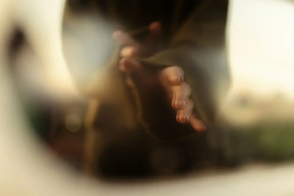 Hands clasped in prayer, spiritual integration and mental health support