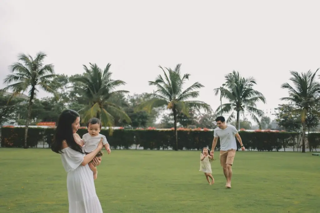 Family walking in Hoi An, Vietnam; blessing from the Lord, Christian faith and family.