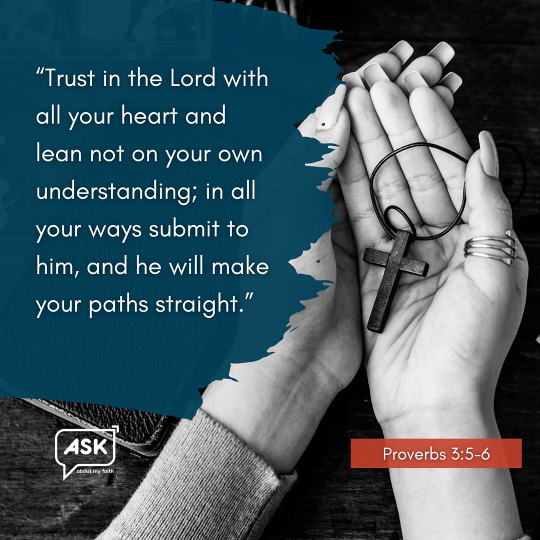 Hands in prayer holding a wooden cross, Bible verse from Proverbs 3:5-6, faith and trust in God.